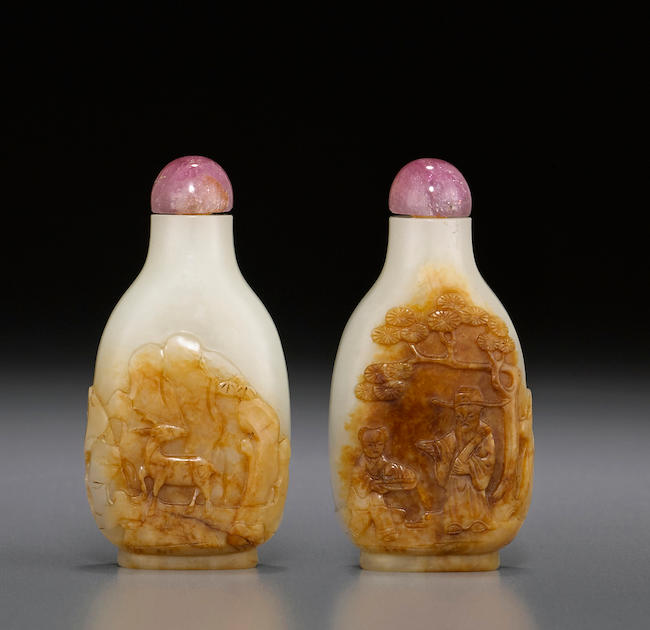  A carved white and russet jade snuff bottle 