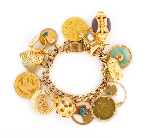 Bonhams : A fourteen karat gold charm bracelet