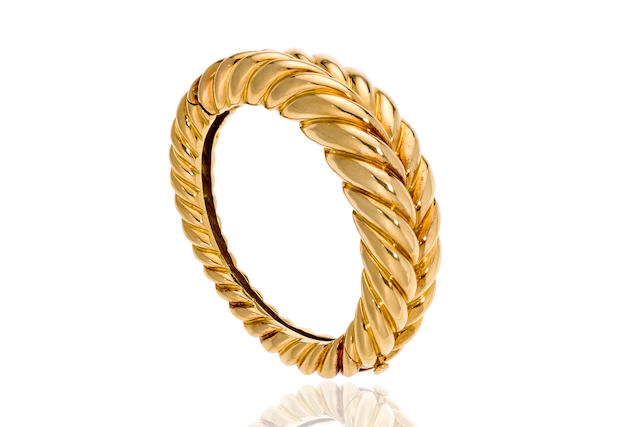 Bonhams : An eighteen karat gold bangle bracelet, Tiffany & Co.