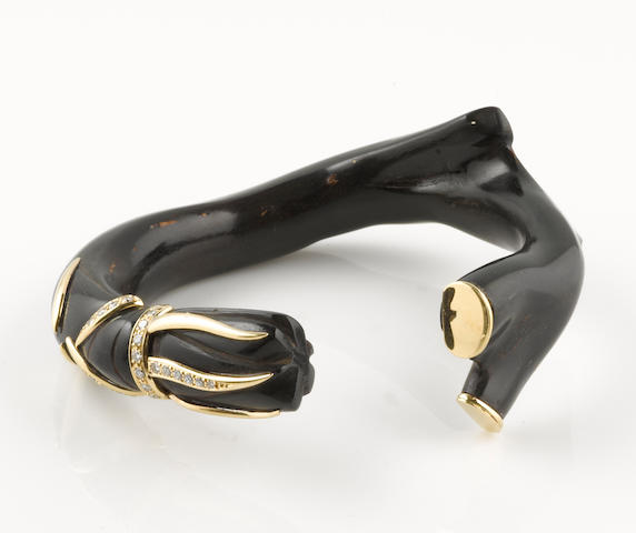 Bonhams : A black coral, diamond and 18k gold bangle bracelet