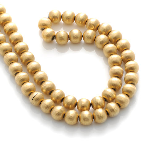 Bonhams : An 18k gold bead necklace
