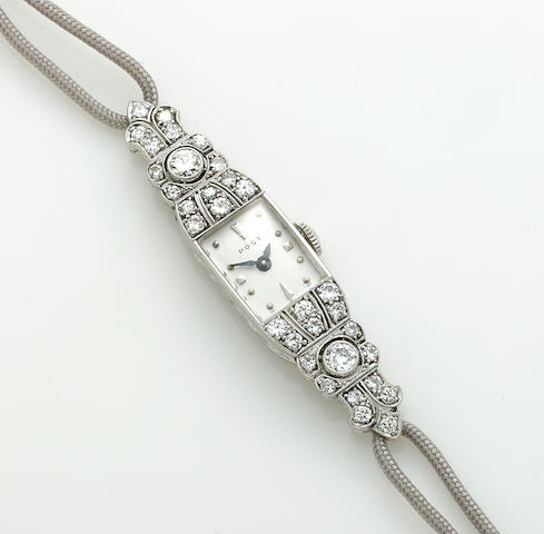 Bonhams : A diamond, 18k white gold, platinum and cord strap wristwatch