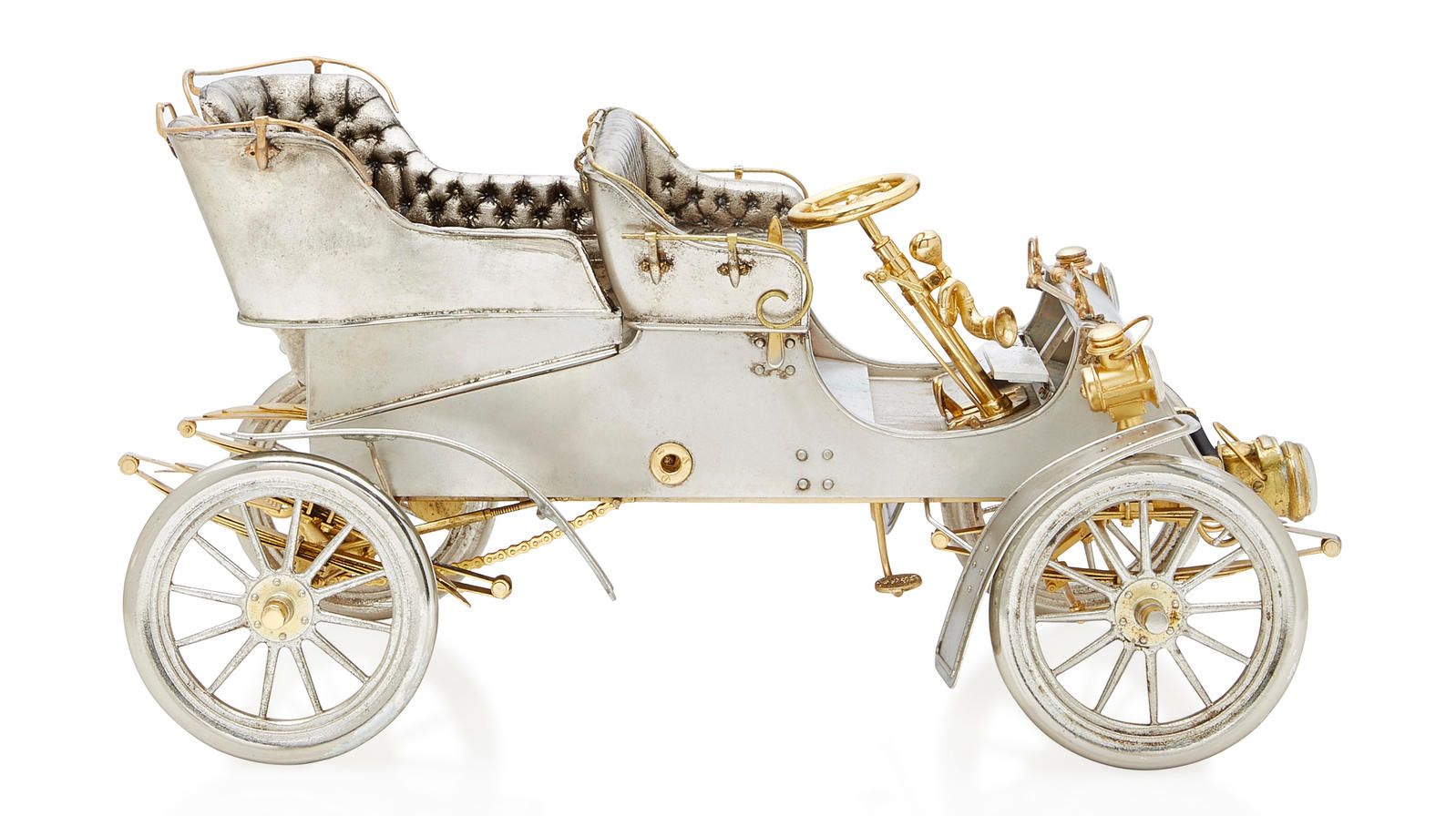 Bonhams Cars : A SILVER AND GOLD MODEL OF A 1903 MODEL A FORD, BY