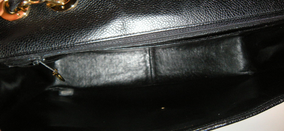 Bonhams : A Chanel black quilted leather Maxi handbag