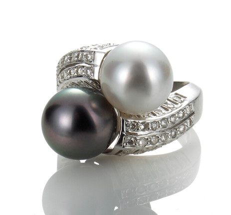 Bonhams : A black and white cultured pearl and diamond bypass ring