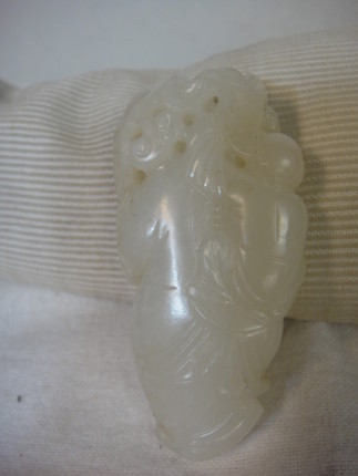 Bonhams : A white jade carving of a boy 19th century