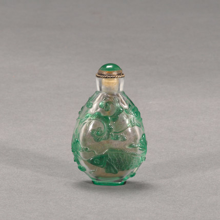 Bonhams : A green glass overlay snuff bottle