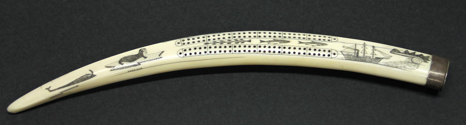 Bonhams : An Eskimo scrimshaw walrus ivory cribbage board