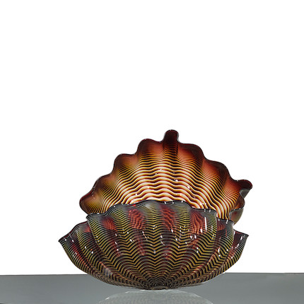 Dale Chihuly (born 1941) Two Part Seaform1999blown glass, signed 'Chihuly 1999'height of first 8 1/4in (21cm); width 20in (51cm); depth 8 1/2in (22cm); height of second 8 1/2in (22cm); length 20 3/4in (52.5cm); depth 13 1/2in (34cm) image 1