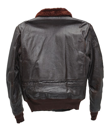 J.F.K.'S AIR FORCE ONE BOMBER JACKET GIVEN TO DAVID POWERS. An original U.S. Government issue G-1 flight jacket, with sewn patch of the Seal of the President of the United States over the right breast, originally owned by President John F. Kennedy and gifted to David Powers circa 1962-1963, image 9