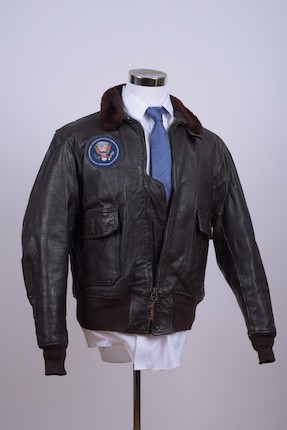 J.F.K.'S AIR FORCE ONE BOMBER JACKET GIVEN TO DAVID POWERS. An original U.S. Government issue G-1 flight jacket, with sewn patch of the Seal of the President of the United States over the right breast, originally owned by President John F. Kennedy and gifted to David Powers circa 1962-1963, image 6