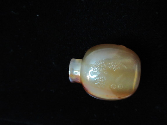 Bonhams : A miniature chalcedony agate Suzhou-type 'monkey and Peach ...