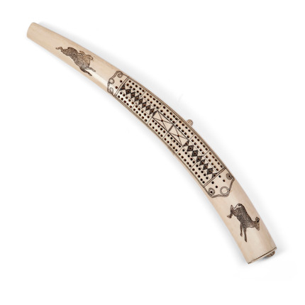 Bonhams Skinner : An Eskimo walrus tusk cribbage board lg. 18 1/2 in.