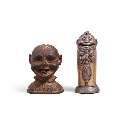 TWO CLOWN-FORM PIGGY BANKS early 20th centurythe taller silver piggy bank with saying 'ALWAYS BE PREPARED FOR A RAINY DAY', the shorter titled 'BILL E. GRIN'; taller with various hallmarksheight of tallest 5 1/2in (14cm) image 1