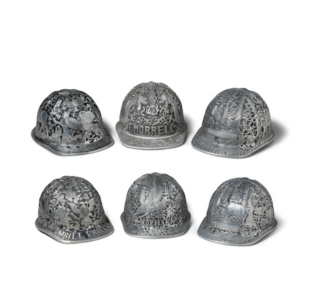 A GROUP OF SIX SOUTHEAST HANDWROUGHT AND DECORATED ALUMINUM MINERS CAPS mid-20th centurylength 12in (30cm); width 9in (23cm) image 1