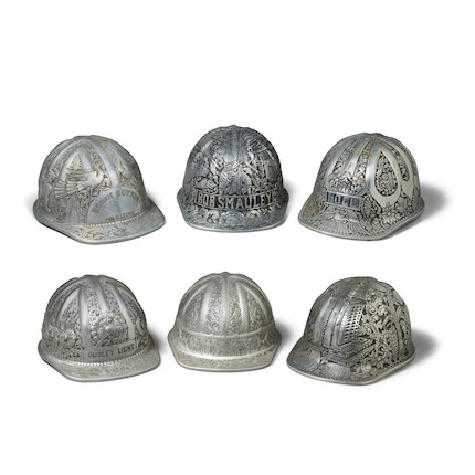 A GROUP OF SIX SOUTHEAST ASIAN HANDWROUGHT AND DECORATED ALUMINUM MINERS CAPS mid-20th centurylength 12in (30cm); width 9in (23cm) image 1