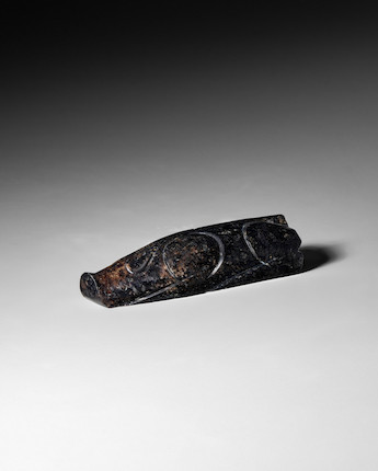 AN ARCHAIC BLACK JADE CARVING OF A PIG Han Dynasty image 1