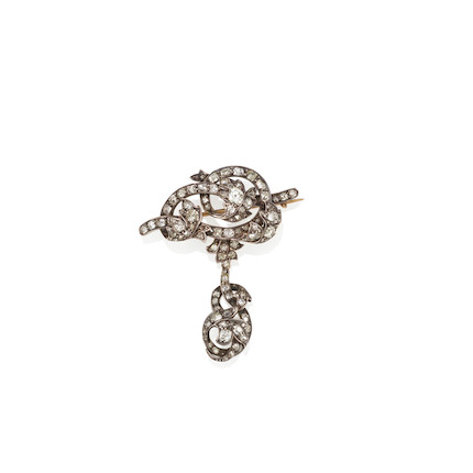 A GOLD, SILVER-TOPPED GOLD AND DIAMOND BROOCH image 1