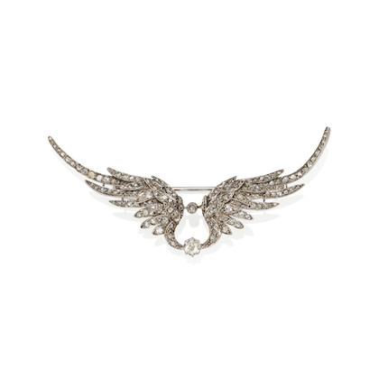 A SILVER-TOPPED GOLD AND DIAMOND WING BROOCH image 1