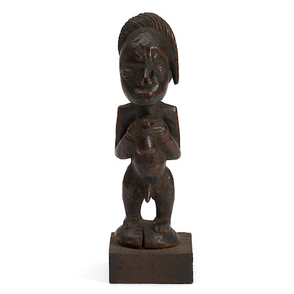 A male Yoruba figure ht. 11 1/2 in. image 1