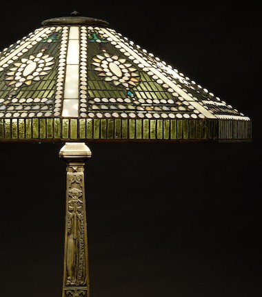 Tiffany Studios Empire Jewel Table Lamp, New York, New York, 1910-1913, leaded glass and patinated bronze, shade with stamped mark Tiffany Stvdios N.Y. 1958, dia. 23 1/4, with an Old English base, four-socket cluster, Perkins paddle switches, stamped mark Tiffany Studios New York 557, total ht. 25 3/4 in.Literature Alistair Duncan, Tiffany Lamps and Metalwork, (new edition), shade, plate 833, p. 214, base, plate 834, p. 215. image 2