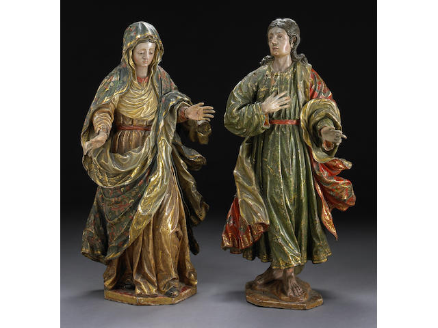 A pair of Spanish Baroque polychrome decorated carved figures of Mary and St. John 17th century