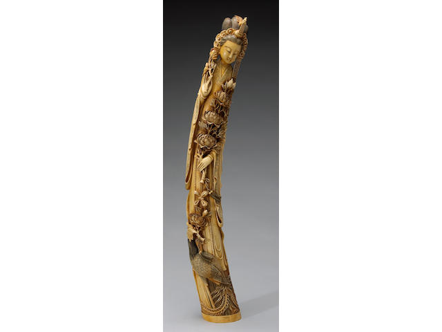 A tinted ivory figure of a beauty and phoenix