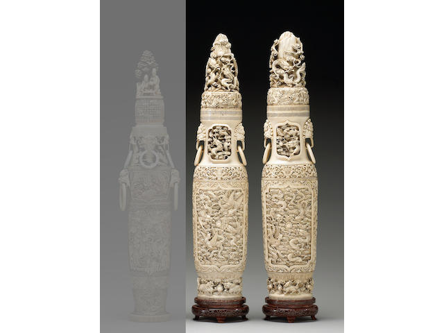A pair of tall pieced ivory covered urns with dragon and phoenix decoration