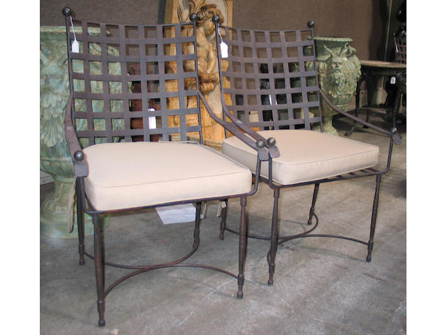 A suite of ten patinated metal Thomas Bartlett armchairs