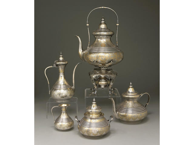 A French parcel-gilt 950 standard silver four piece tea and coffee set with plated matching kettle on