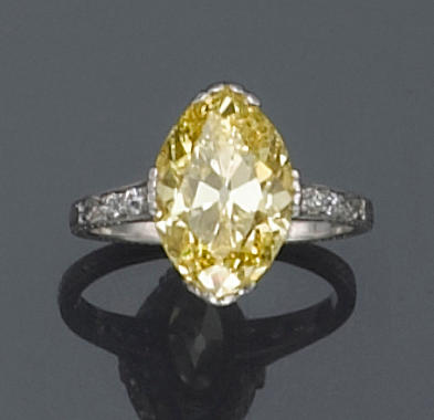 A natural fancy color diamond, diamond and platinum ring,