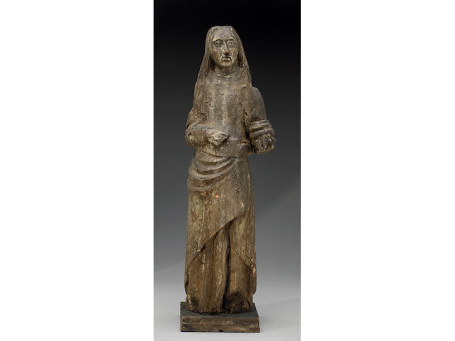 A European carved and painted wood figure of St. Mary Magdalene