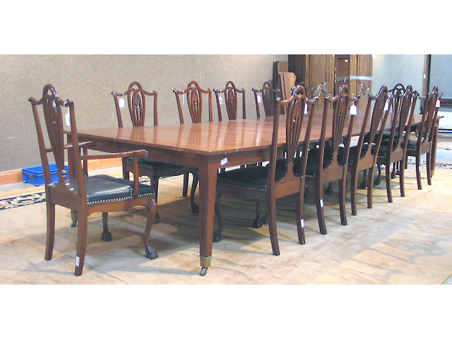 An assembled George III style mahogany dining suite, comprising an extension table, two armchairs and ten side chairs