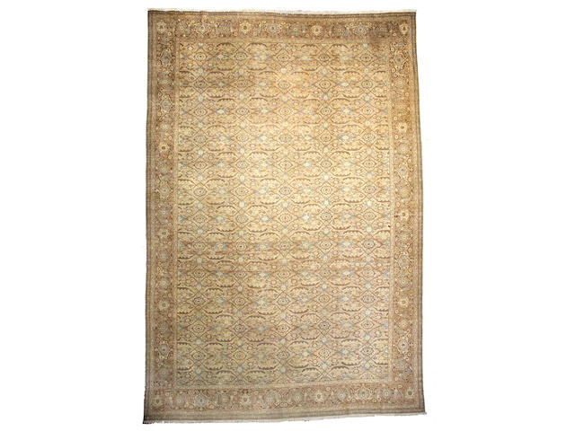 A Tabriz carpet Northwest Persia, Size approximately 16ft 10in x 11ft 4in