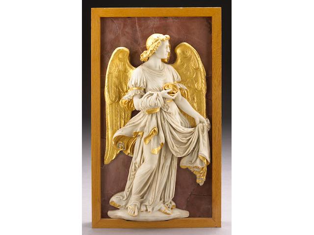 A carved white marble and parcel gilt relief panel of an angel with dice and cloak on a faux rosso antico ground