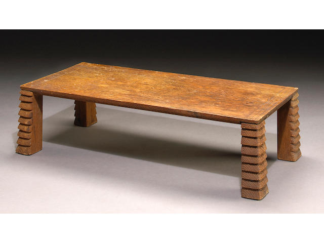 A fine and rare Jean-Michel Frank carved and sanded oak table