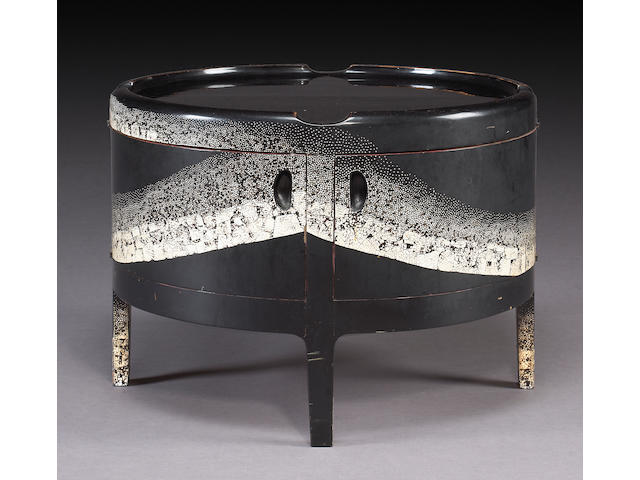 A fine and rare Jean Dunand eggshell lacquer drum table