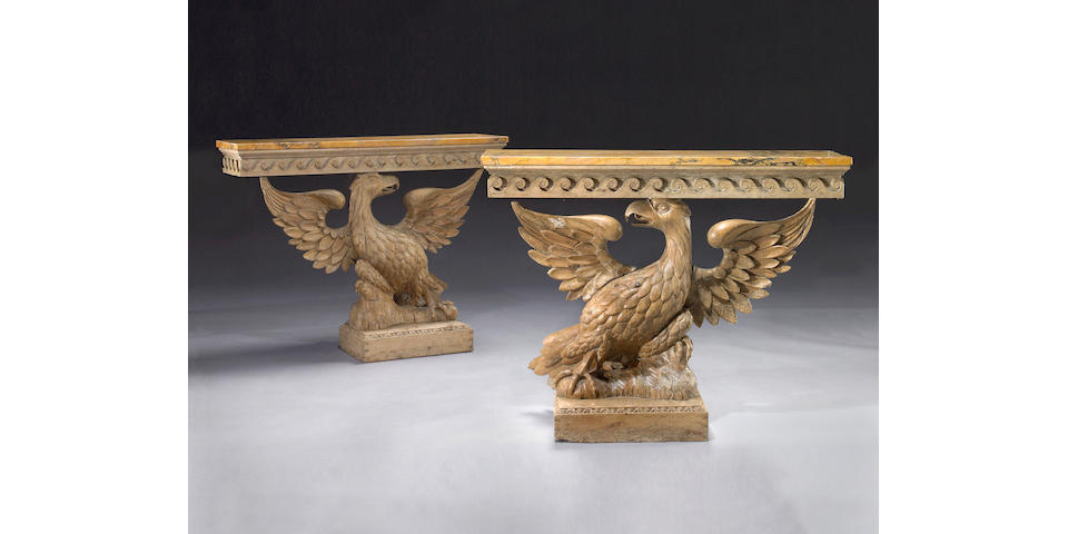 A pair of carved pine console tables
