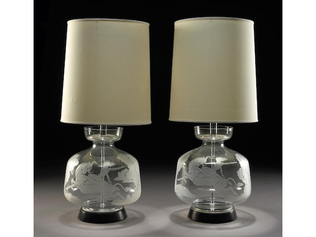 A pair of engraved glass and metal table lamps