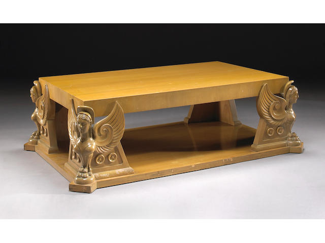 A T.H. Robsjohn-Gibbings carved harewood winged-sphinx coffee table