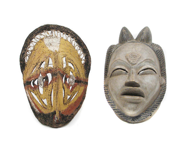 A collection of Tribal decorative masks and carvings in various media