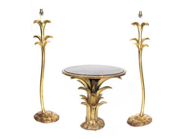 An Art Deco style occasional table and two matching floor lamps