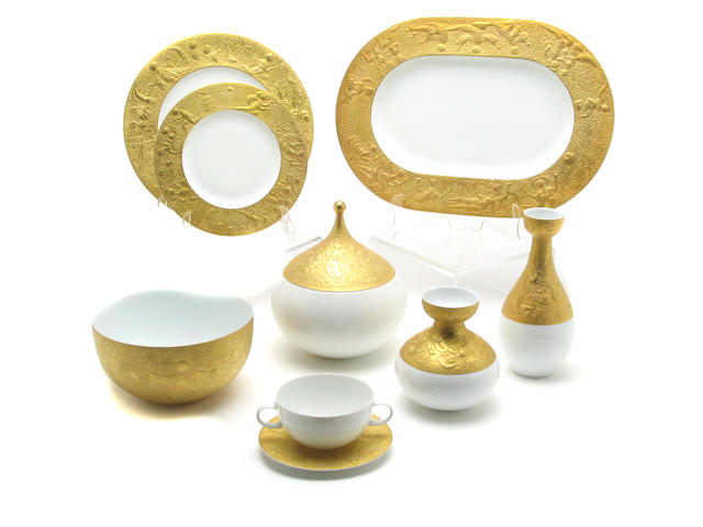 A Rosenthal gilt decorated porcelain part dinnerware service by Bjorn Winblad in the Magic Flute pattern