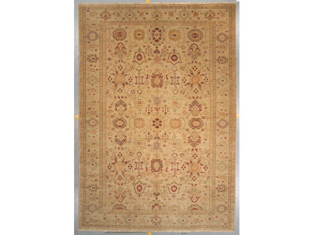 An Indian carpet size approximately 15ft 3in x 10ft 8in