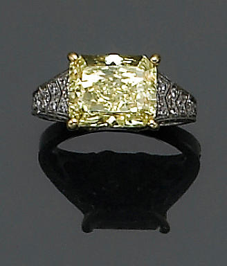 A natural fancy color diamond, diamond, platinum and gold ring