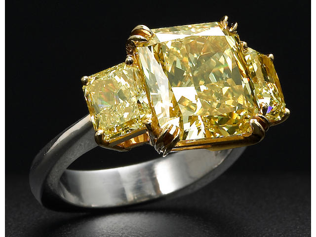A natural fancy color diamond, platinum and eighteen karat gold ring