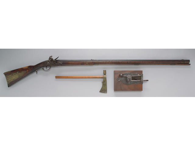 An American full-stocked flintlock rifle and pipe tomahawk by Jacob Welshans, Sr.