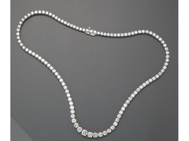 A diamond and eighteen karat white gold necklace