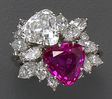 A diamond, pink sapphire and platinum ring
