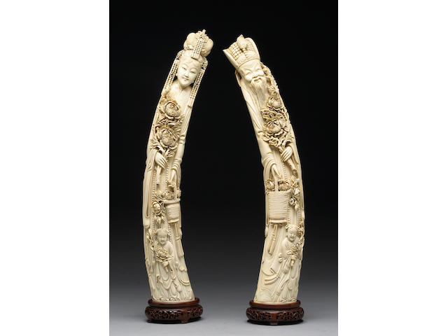 A pair of large ivory emperor and empress figures